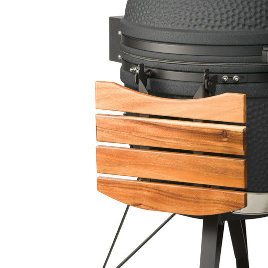 Detail van een ingeklapte walnoot zijtafel aan de kamado